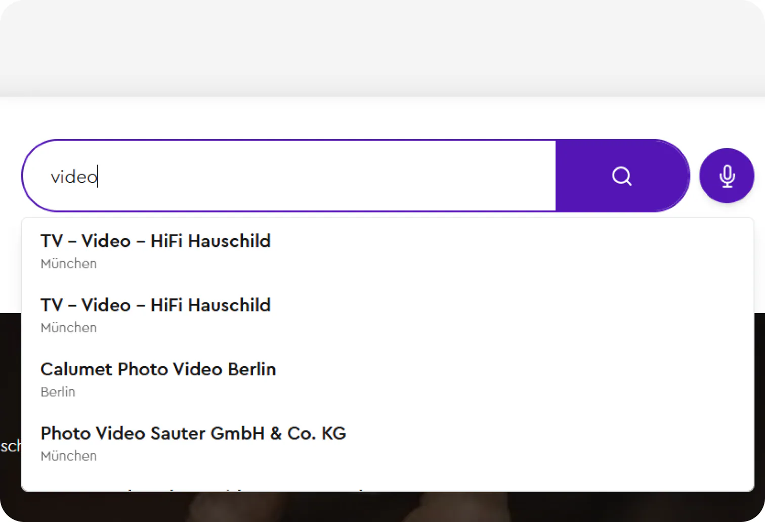 Cheggl search bar with a microphone button: typing “video” suggests matching businesses such as TV – Video – HiFi Hauschild in München and Calumet Photo Video Berlin