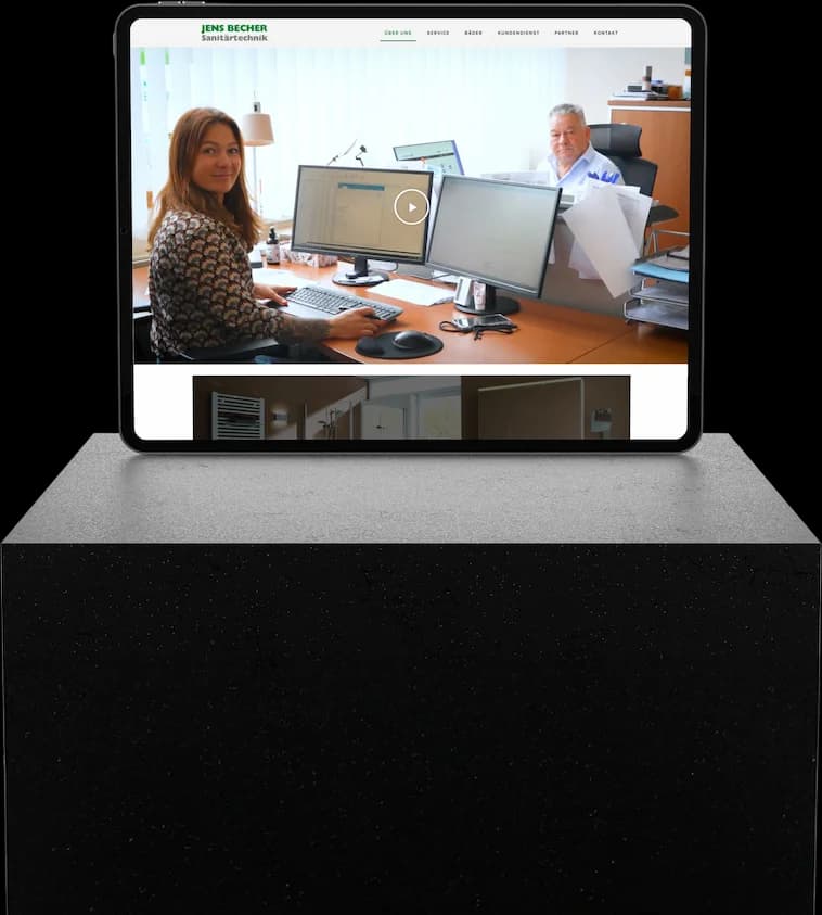 iPad on a dark stone podium showing the Über uns page of the Jens Becher Sanitärtechnik website