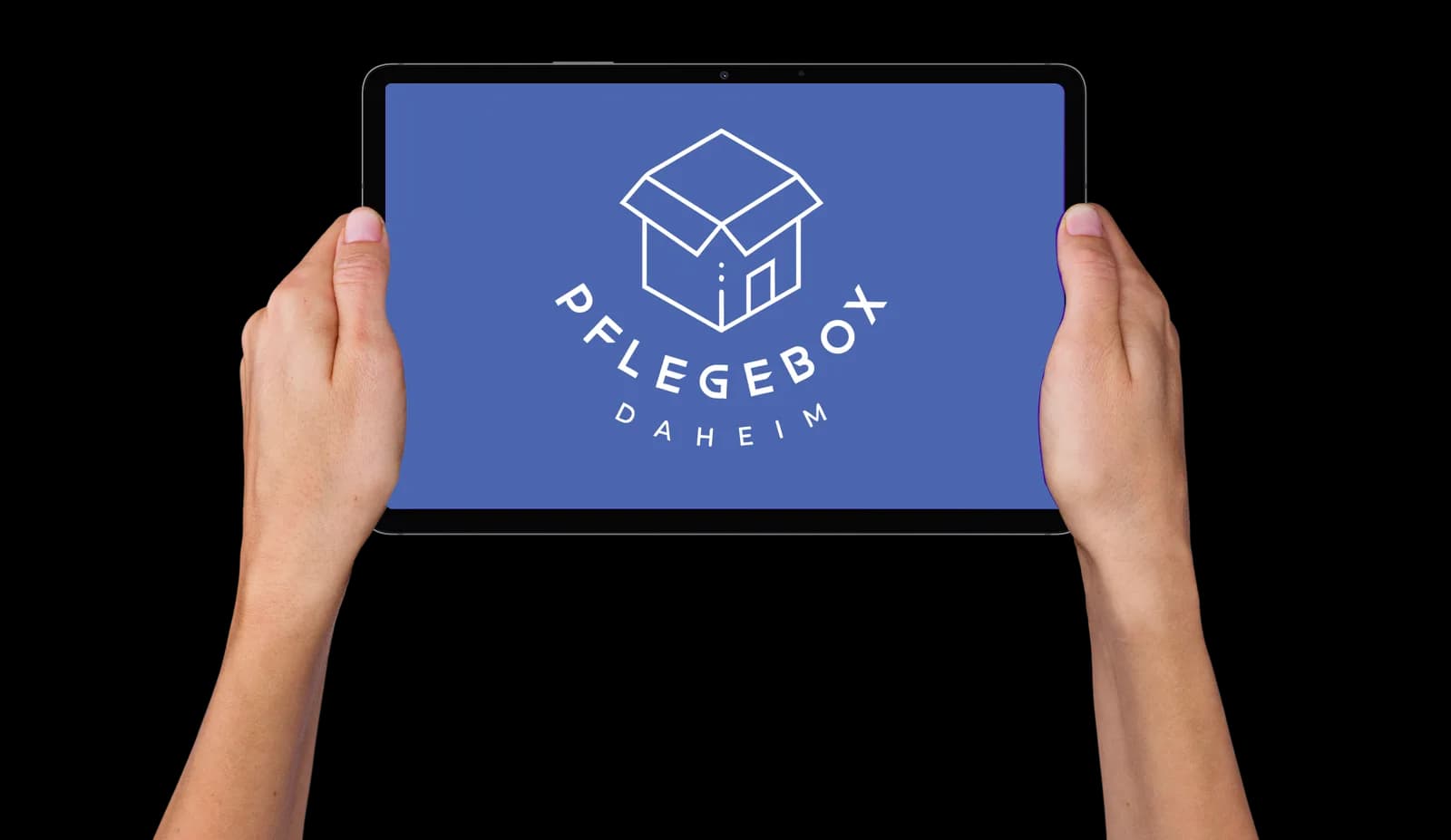 Two hands holding up a tablet showing the white Pflegebox Daheim box-and-house logo on the brand’s primary blue