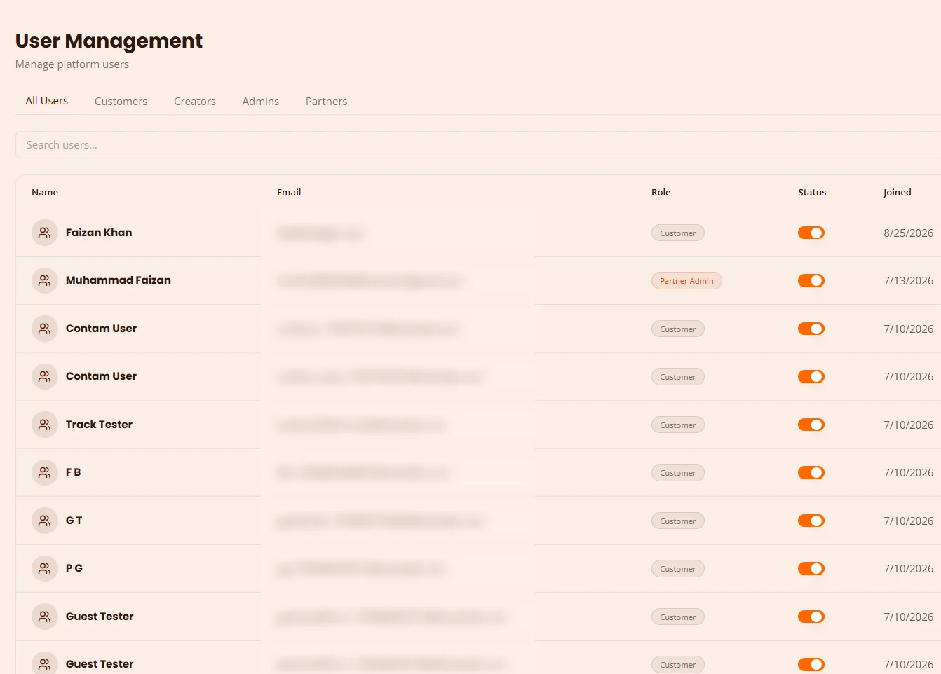 The User Management screen: tabs for all users, customers, creators, admins and partners, and a table of users with role, an on/off status toggle and join date. Email addresses are blurred.