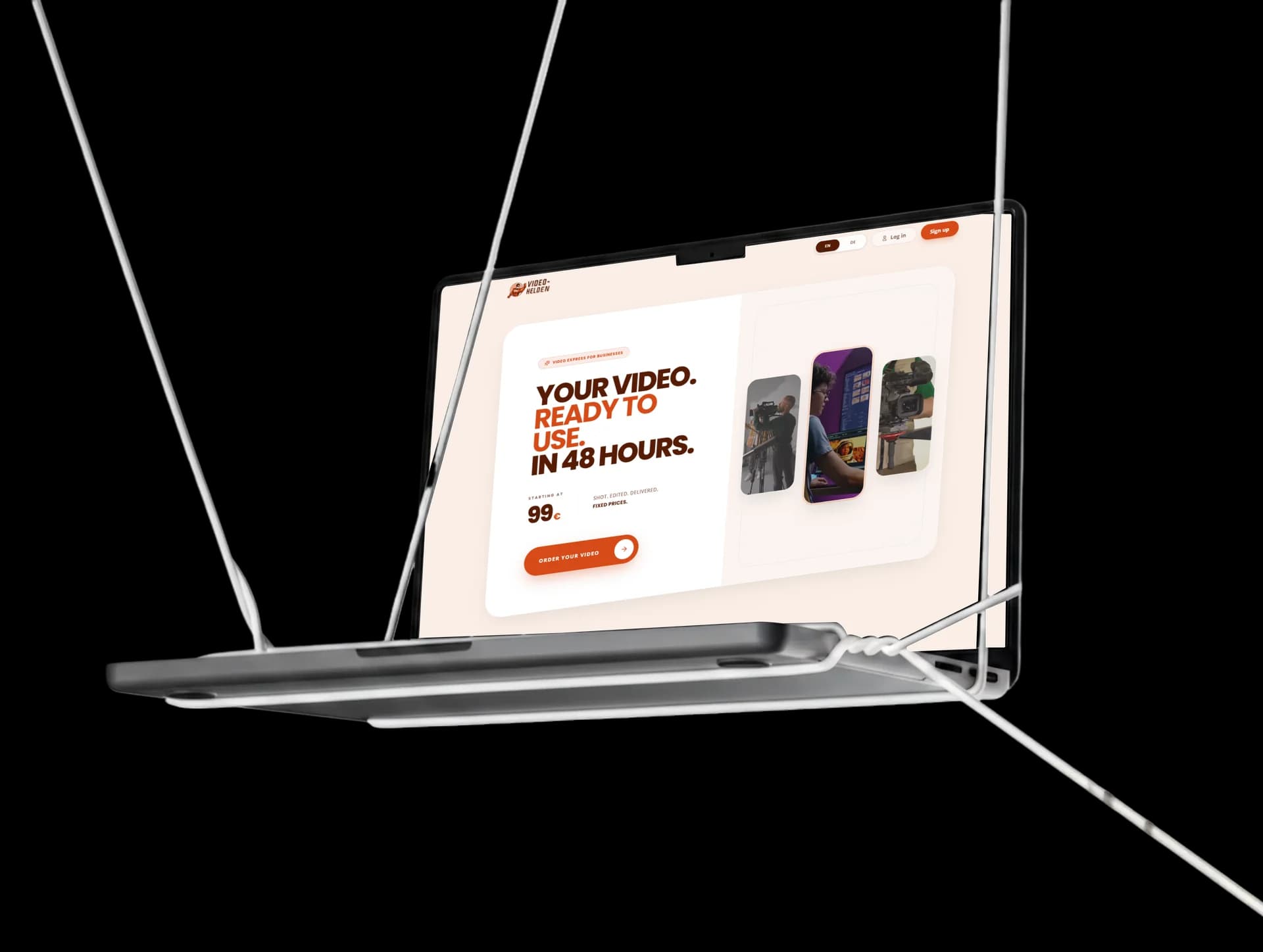 The Video Helden homepage on a MacBook hanging from white cables: “Your video. Ready to use. In 48 hours.”, with a starting price and an Order your video button.